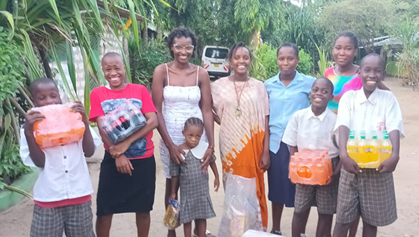 This is our Kenya representative, Immaculate (in white) giving juice to the orphans at Green Olive Children’s Home.  Thanks to givenet.org sponsors.